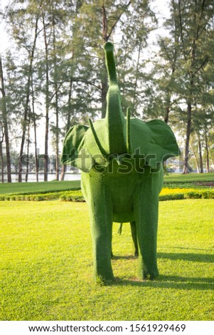 Giant animal sculptures made from grass.