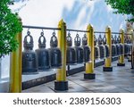 Giant bells in a row at a buddhist monestary. Wat Doi Suthep temple, Chiang Mai, Thailand.