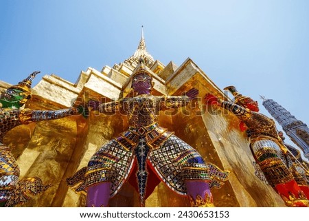 Giant carrying a pagoda base in Wat Phra Kaew. Here are the main tourist attractions in Bangkok, Thailand.