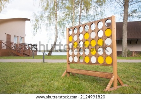 Giant connect four in a line garden wooden game