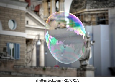 Giant flying soap bubble in city