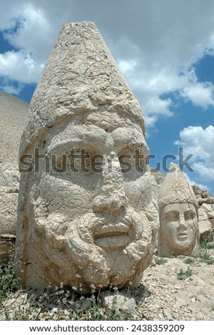 Giant God heads on Mount Nemrut. Anatolia, Turkey. Ancient colossal stone statues representing legendary mythological figures