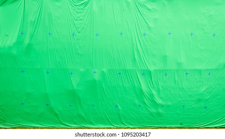 Giant Green Screen Chroma Key Background On Commercial Set. Big Green Background For Added Special Effects In Post Production.