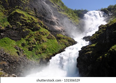 Giant Kjosfossen Waterfall By The Flåm To Myrdal Railway Line, Norway