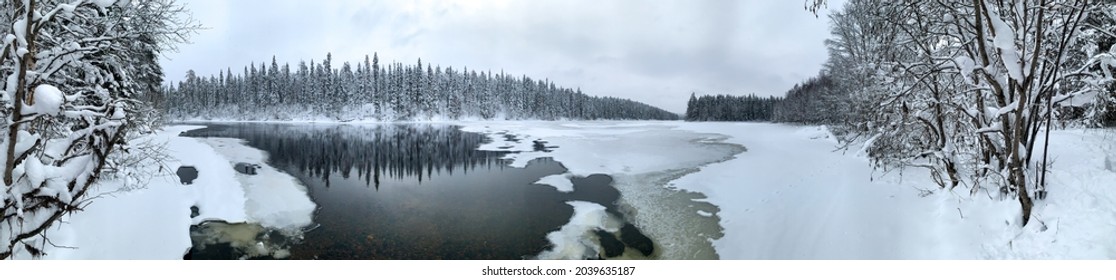 Giant panorama of snow-covered ice-river among a frozen taiga forest in a winter - Powered by Shutterstock