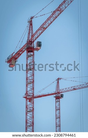 Giant Red Construction Cranes - Portrait