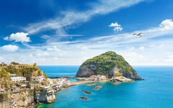 Giant Rock With Green Trees On Top Near Small Village Sant'Angelo On Ischia Island, Italy
