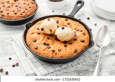 Giant skillet cookie with chocolate chips served with ice cream. - Powered by Shutterstock