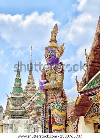 Giant statues in the temple of the Emerald Buddha Thailand.