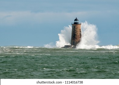 Giant waves cover the stone tower of Whaleback lighthouse in southern Maine during an astronomically high tide.