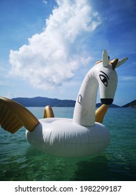 Giant White Flying Horse Float In The Water