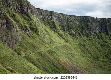 Giants Causeway, County Antrim, Northern Ireland - Aug 30, 2020: People Walking On Giant's Causeway Trails