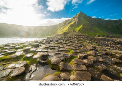 The Giant's Causeway at dawn on a sunny day with the famous basalt columns, the result of an ancient volcanic eruption. County Antrim on the north coast of Northern Ireland, UK - Shutterstock ID 776049589