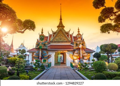 Giants front of the church at Wat Arun. Wat Arun is a Buddhist temple in Bangkok Yai district of Bangkok, Thailand. Wat Arun Temple at sunset in bangkok Thailand. - Shutterstock ID 1294829227