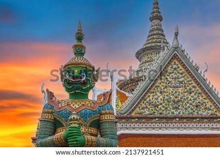 Giants front of the church at Wat Arun Temple. Wat Arun is among the best known of Thailand's landmarks. Wat Arun is a Buddhist temple in Bangkok Yai district of Bangkok, Thailand. 

