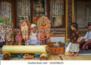 GIANYAR/BALI-AUGUST 14 2019: A Young Balinese Child Watching A Shadow Play. Wayang Kulit Or Shadow Puppets Is One Of Balinese Arts That Is Continuously Preserved