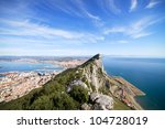 Gibraltar Rock view from above, on the left Gibraltar town and bay, La Linea town in Spain at the far end, Mediterranean Sea on the right.