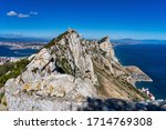 Gibraltar Rock view from above, on the left Gibraltar town and bay, La Linea town in Spain at the far end, Mediterranean Sea on the right. UK, Spain