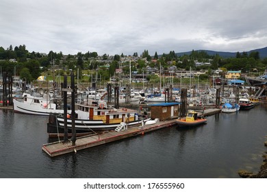 Gibsons Harbor Marina, British Columbia. Gibsons Harbor marina on a gray day with the town of Gibsons in the background. British Columbia, Canada. 