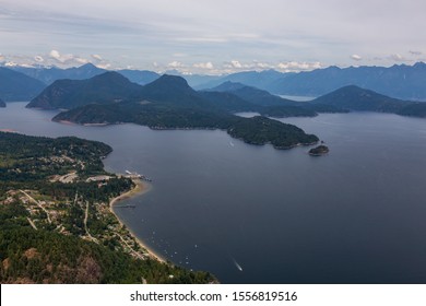 Gibsons, Sunshine Coast, British Columbia, Canada. Aerial View of a small town in Howe Sound during a cloudy summer evening.
