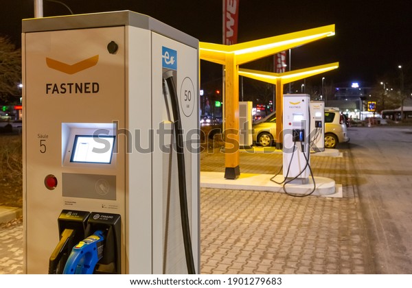 Giessen, Hessen, Germany, January\
16.2021: Fastned electric car charging point at\
night\
