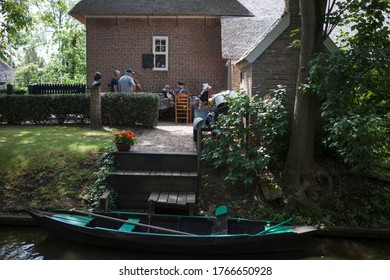 Giethoorn, Overijssel / Netherlands - June 2, 2019 - Traditional Dutch Costume Making Waffles