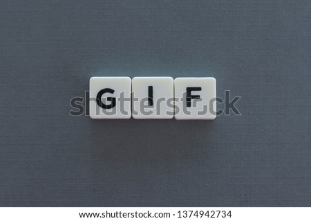 GIF word made of square letter word on grey background.