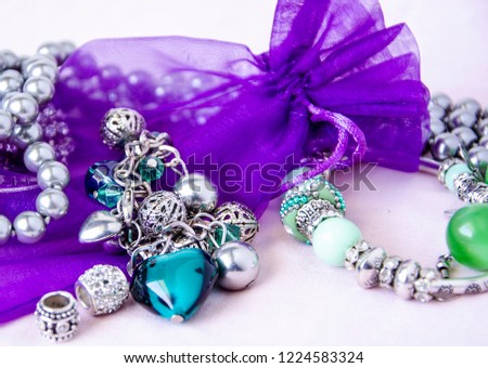 Gift bag in retro style with pearls with jewelry for women.