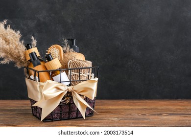 Gift Basket With Cosmetic Products On Dark Wooden Background