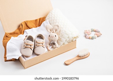 Gift Basket With Gender Neutral Baby Garment And Accessories. Care Box Of Organic Newborn Cotton Clothes