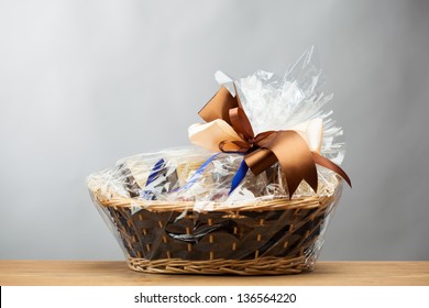 gift in a basket, grey background - Shutterstock ID 136564220