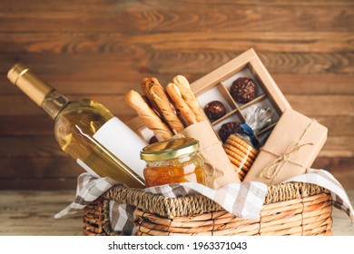 Gift basket with products on wooden background - Shutterstock ID 1963371043