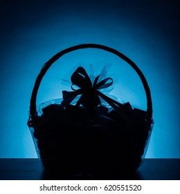 Gift Basket Silhouette On Blue Background