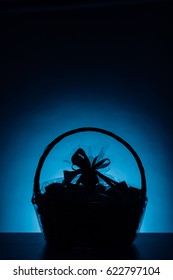 Gift Basket Silhouette On Blue Background