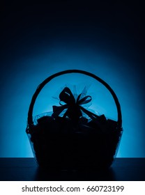 Gift Basket Silhouette On Blue Background