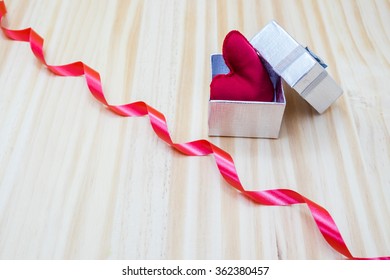 gift box with a bow and a red heart inside
