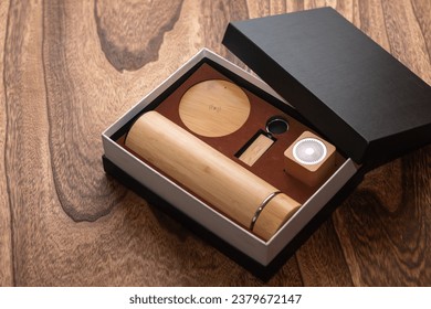 Gift box, an elegantly wrapped package, representing thoughtfulness, concealing surprises and thoughtful expressions of appreciation and love. It contains a notebook, flask, pen and much more.
