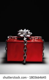 Gift Box Locked In Chain With A Silver Ribbon. Decorative Background Design 