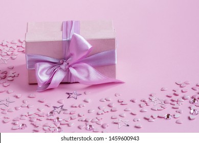 Gift box on pink background. February 14 card, Valentine's day. 8 March, International Happy Women's Day. Flat lay, top view, copy space. Moscow, april 2019