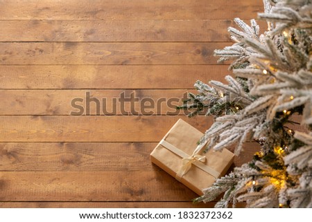 gift box on rough wooden floor. New Year or Christmas background. Greeting card.