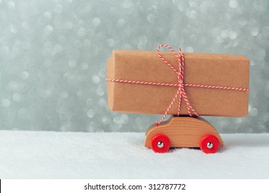 Gift Box On Toy Car. Christmas Holiday Celebration Concept