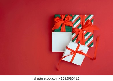 Gift box opened empty space white container top view, xmas advertisement blank,product promotion template top view. New year holiday red display.