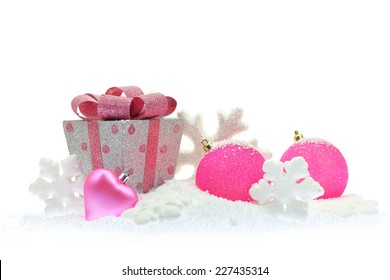 Gift Box And Pink Christmas Ornaments On Snow