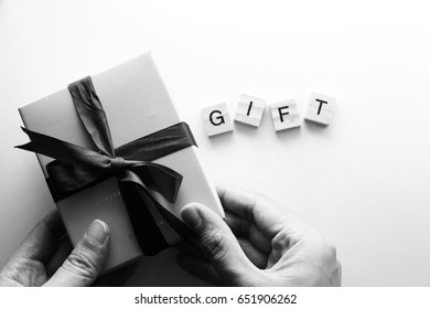 Gift box /. A gift or a present is an item given to someone without the expectation of payment or return.