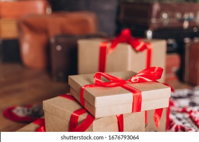 Gift box with presents and red tapes. Holidays concept