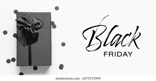 Gift box and text BLACK FRIDAY on white background