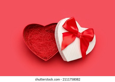 Gift box for Valentine's Day on red background