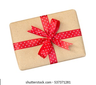 Gift box wrapped in brown recycled paper with red polka dot ribbon bow top view isolated on white background, clipping path included - Powered by Shutterstock