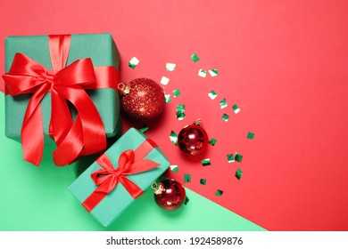 Gift Boxes And Christmas Decorations On Color Background, Flat Lay. Space For Text