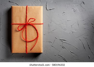 Gift Boxes In Craft Paper On Concrete Background